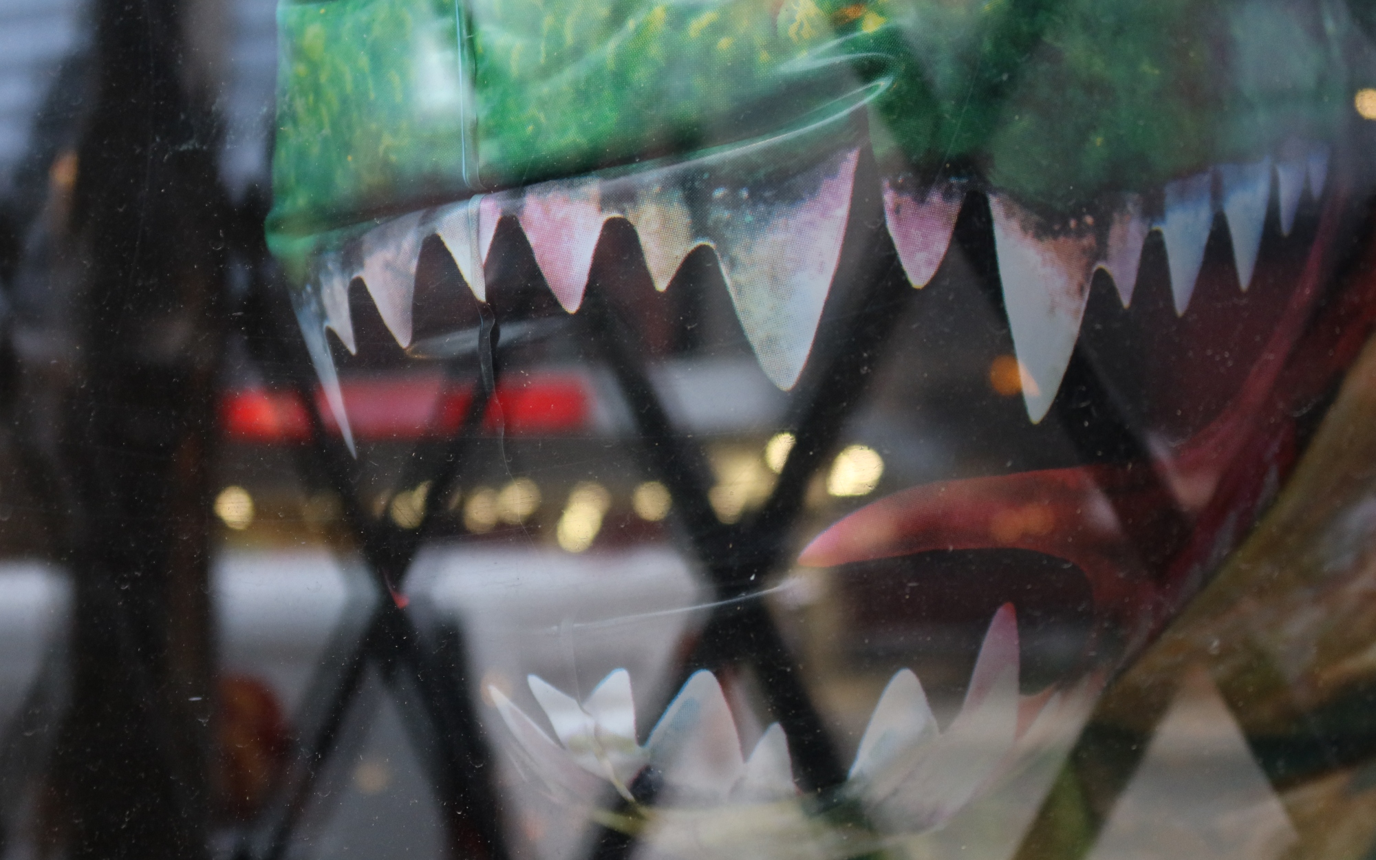 Chicago Dinosaur behind caged glass